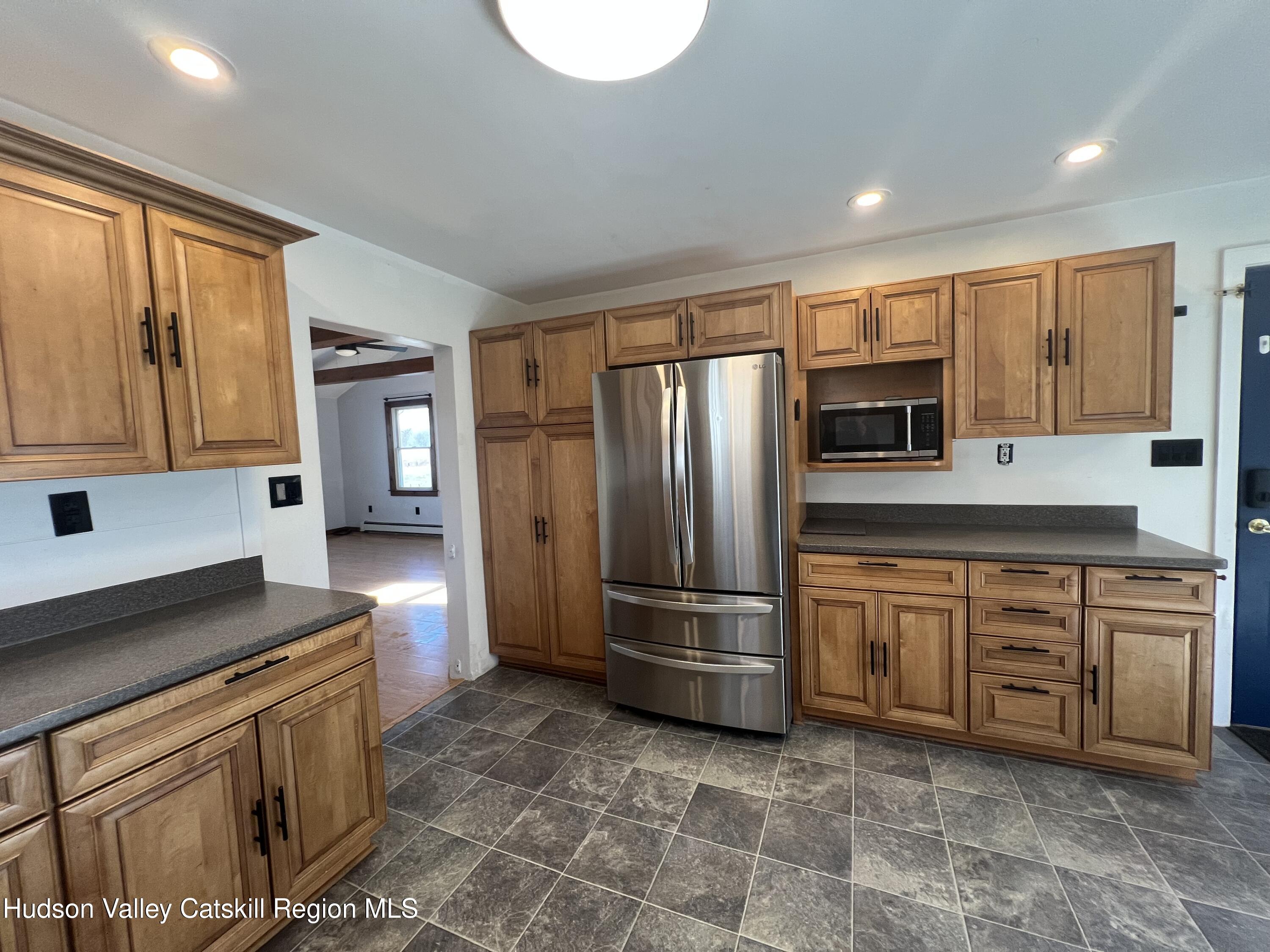 168 County Route Hudson, NY 12534 - Photo 4 of 20 a kitchen with stainless steel appliances granite countertop a refrigerator stove and sink