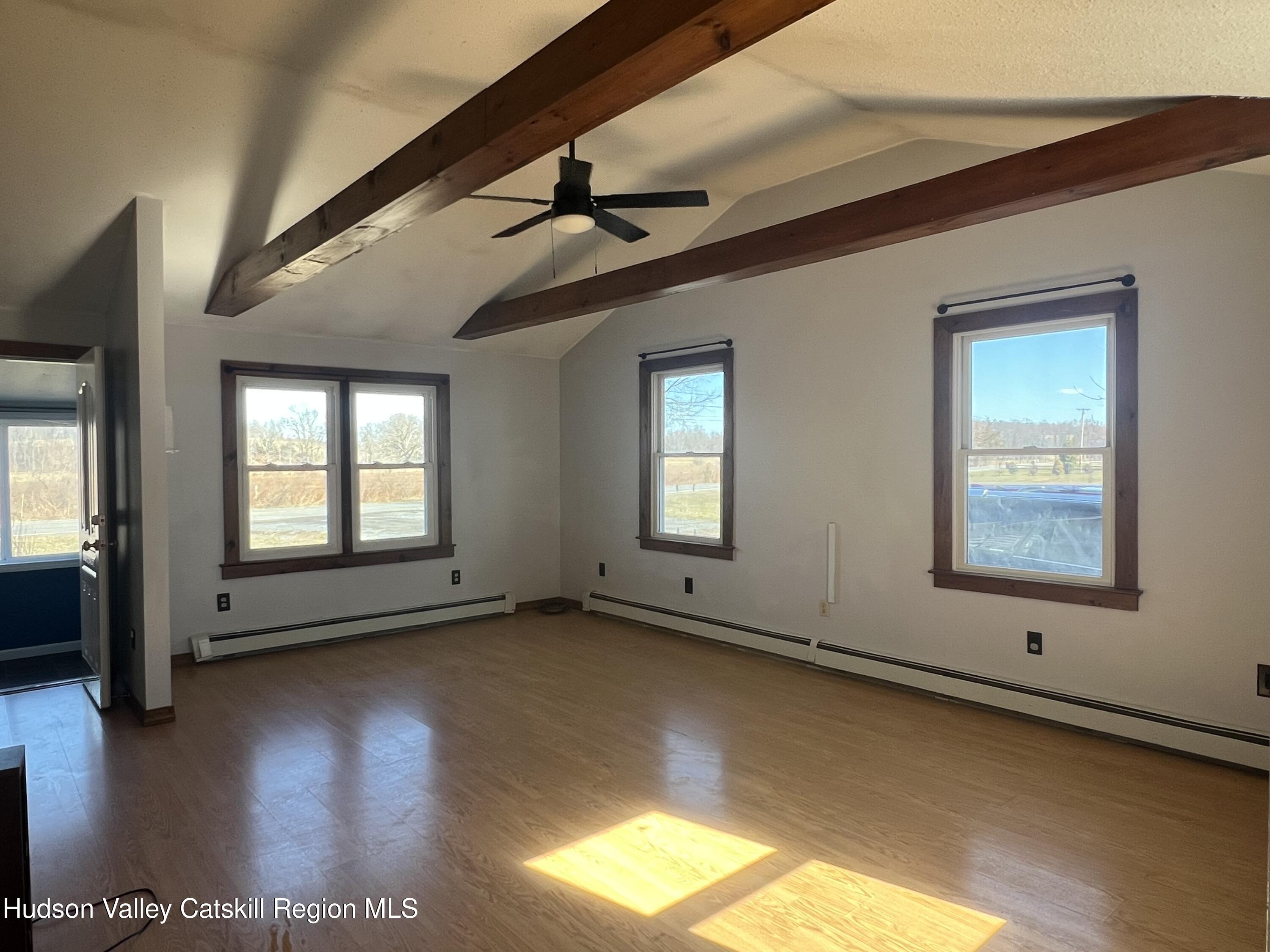 168 County Route Hudson, NY 12534 - Photo 6 of 20 a view of an empty room with window and wooden floor