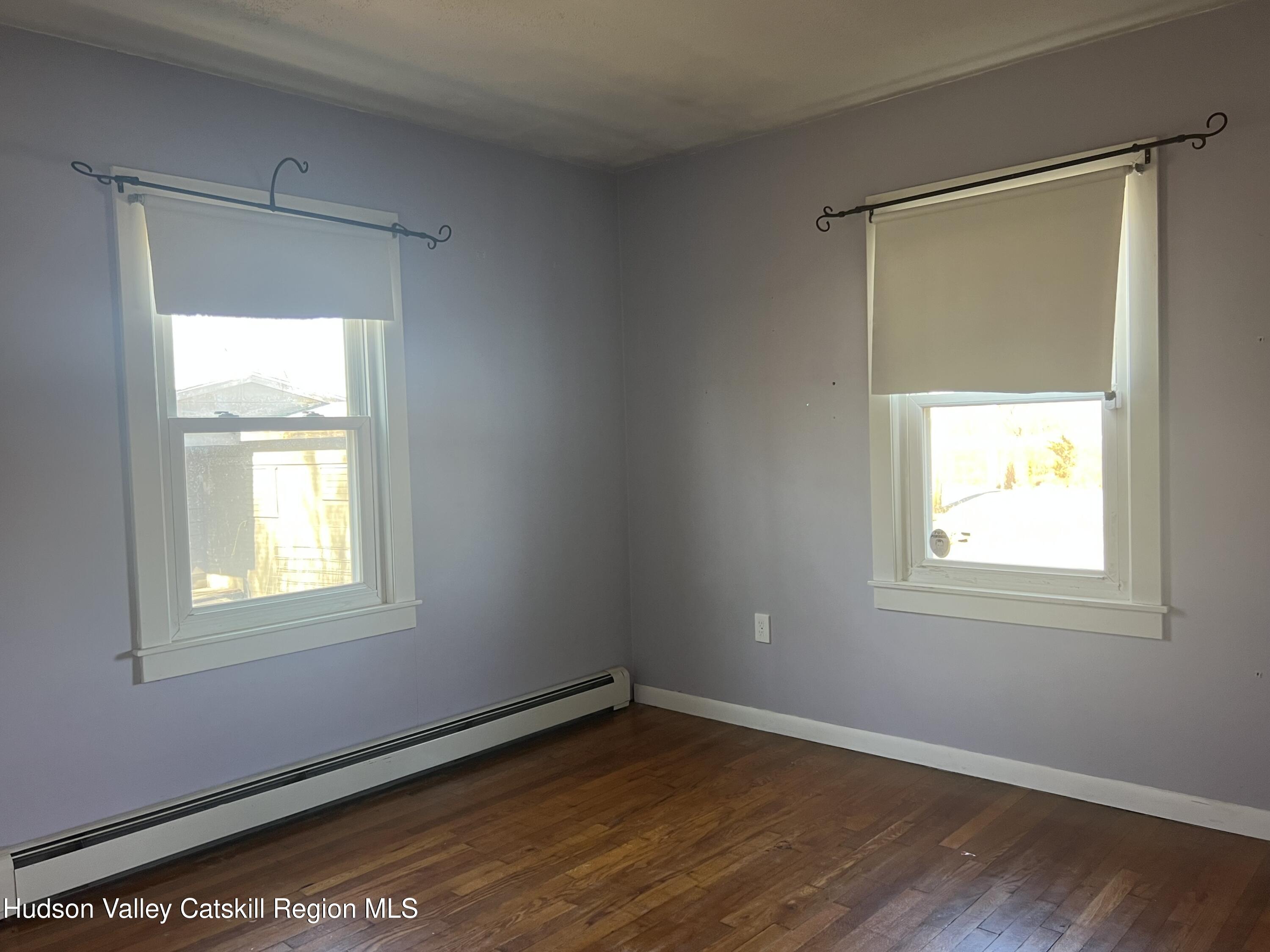 168 County Route Hudson, NY 12534 - Photo 9 of 20 a view of an empty room with wooden floor and a window