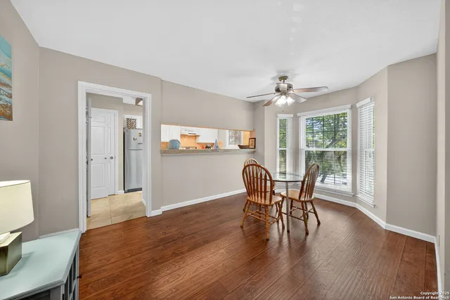 a view of a dining room with furniture window and wooden floor