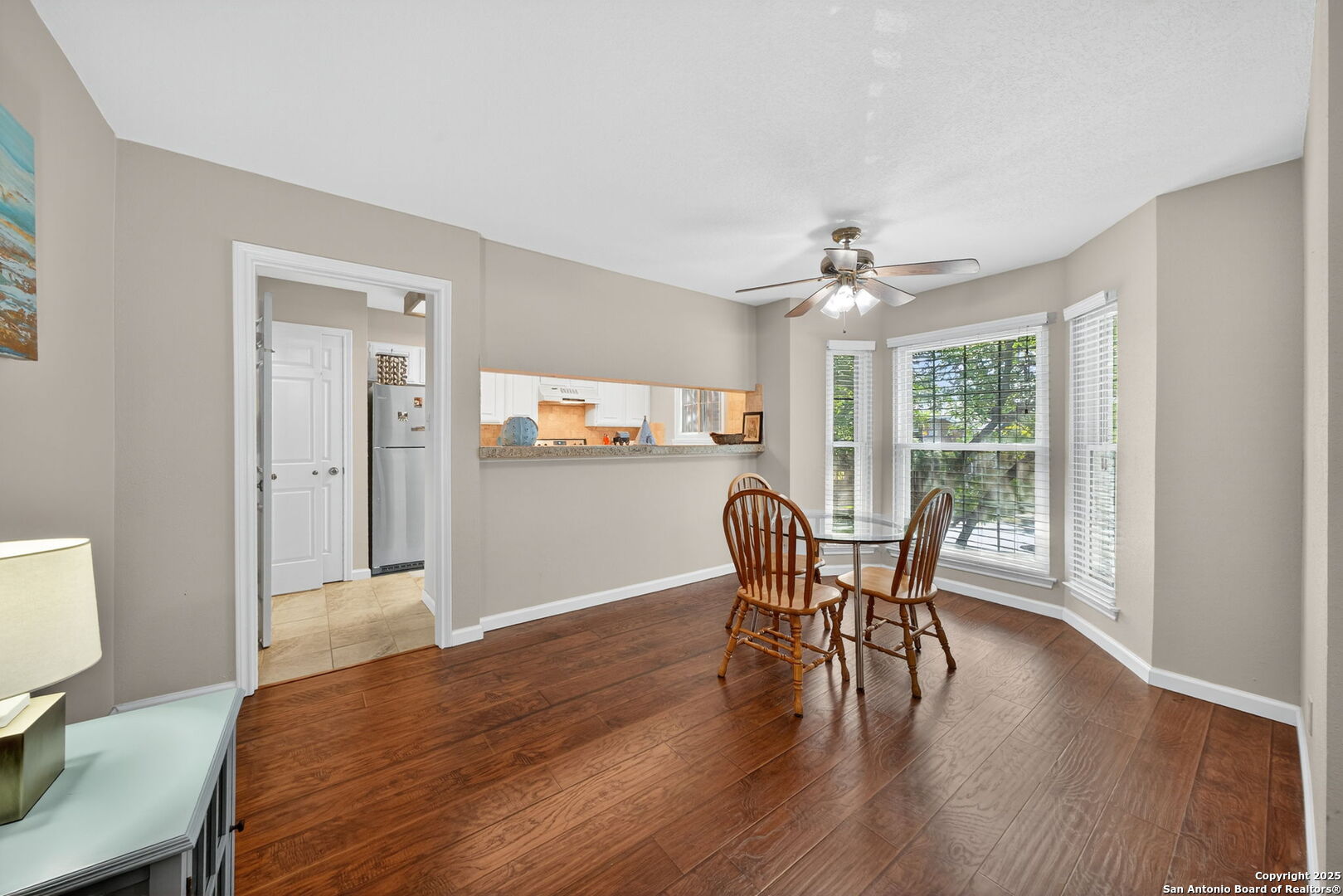 13130 Blanco Road, Unit 206 San Antonio, TX 78216 - Photo 3 of 12 a view of a dining room with furniture window and wooden floor
