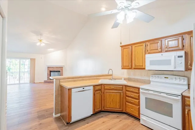 a view of a kitchen counter space with wooden floor