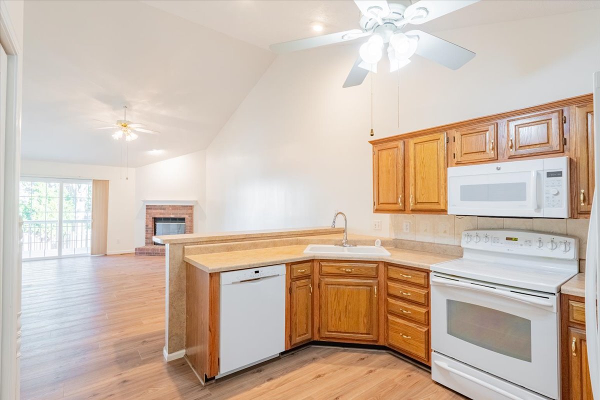 107 North Blair Drive, Unit 8 Normal, IL 61761 - Photo 8 of 29 a view of a kitchen counter space with wooden floor