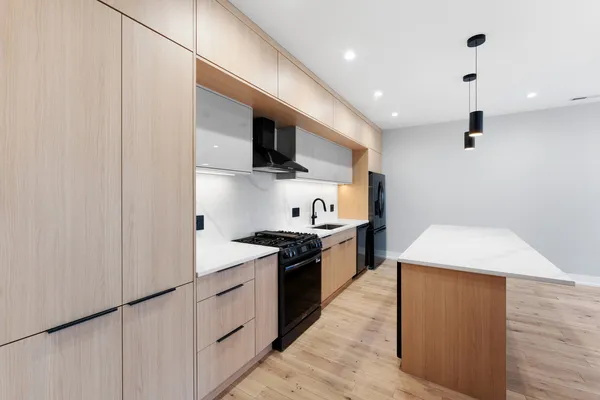 a kitchen with a stove and a sink