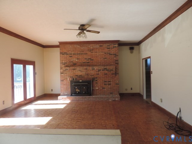102 Hicks Lane Rice, VA 23966 - Photo 10 of 26 a view of an empty room with a fireplace and a window