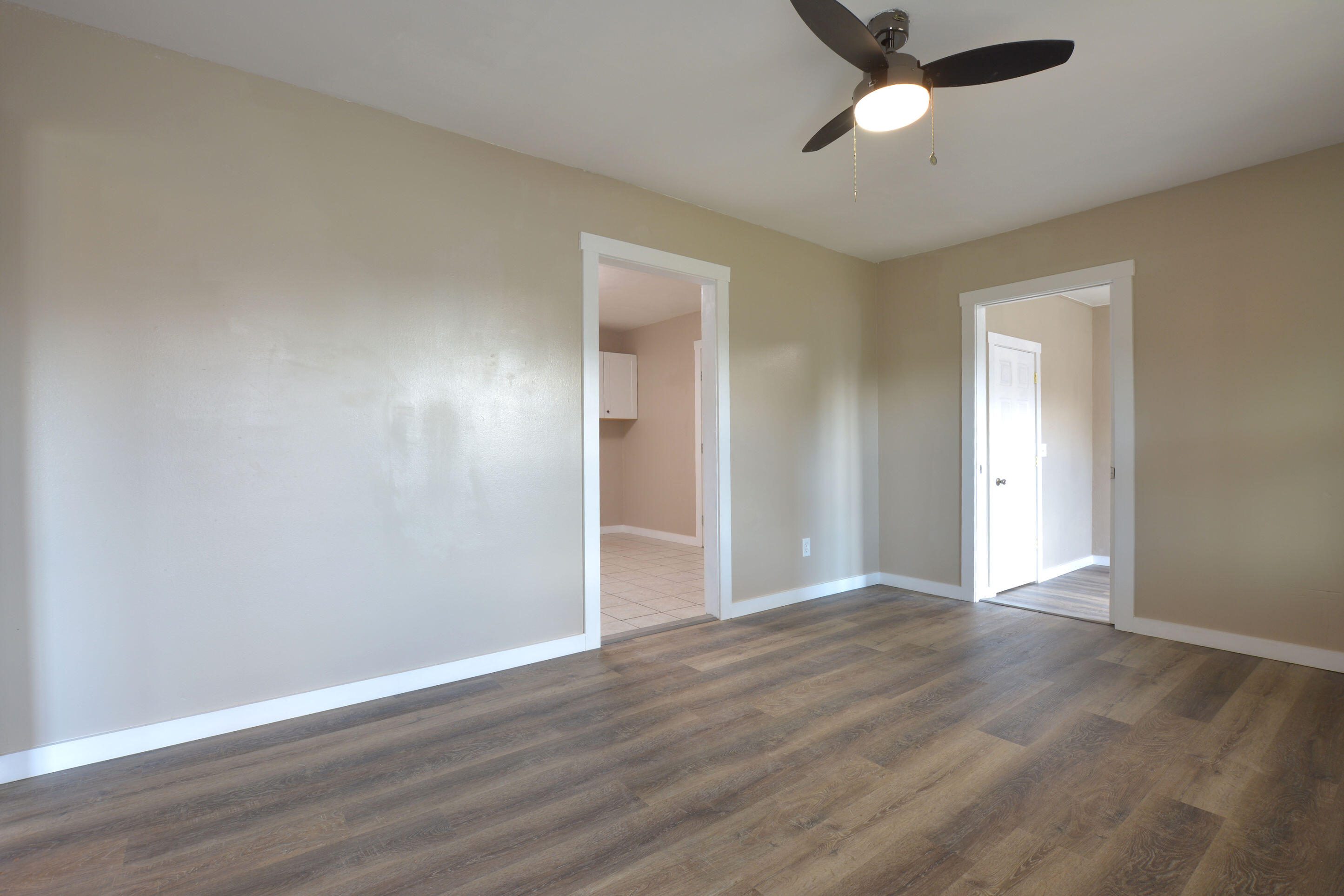 4608 Detroit Avenue Lubbock, TX 79413 - Photo 7 of 20 a view of an empty room with wooden floor