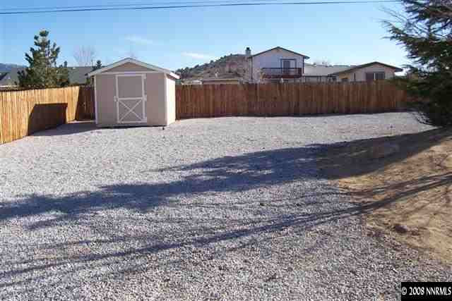 2000 Ron Way Reno, NV 89521 - Photo 8 of 9 a view of a house with a yard