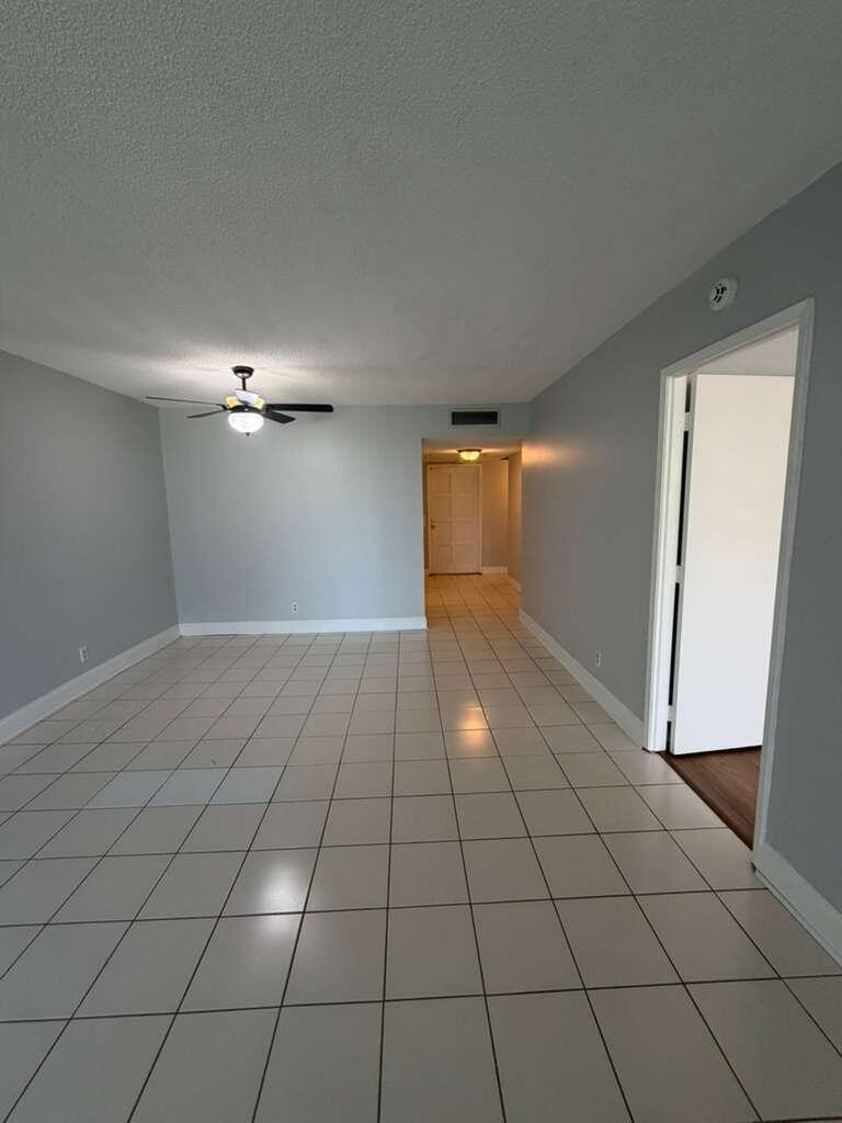 2601 South Course Drive, Unit 203 Pompano Beach, FL 33069 - Photo 11 of 33 a view of an empty room and window