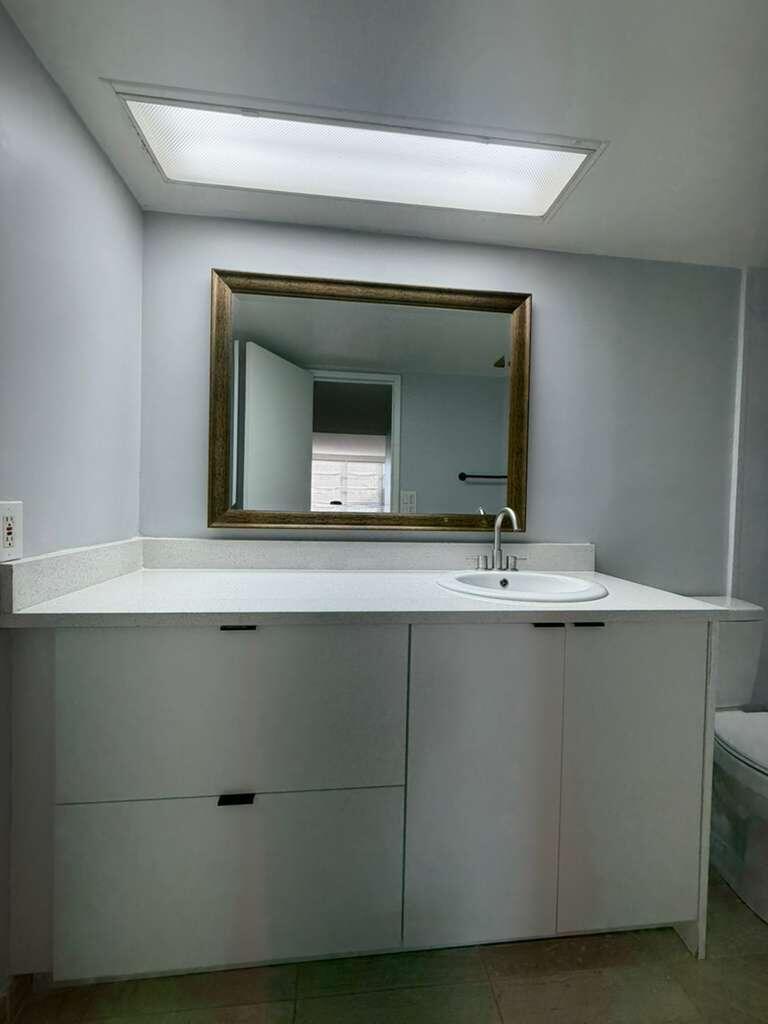 2601 South Course Drive, Unit 203 Pompano Beach, FL 33069 - Photo 24 of 33 a bathroom with a sink and a mirror