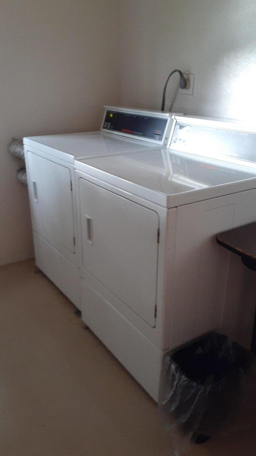 2601 South Course Drive, Unit 203 Pompano Beach, FL 33069 - Photo 31 of 33 a close up view of washer and dryer