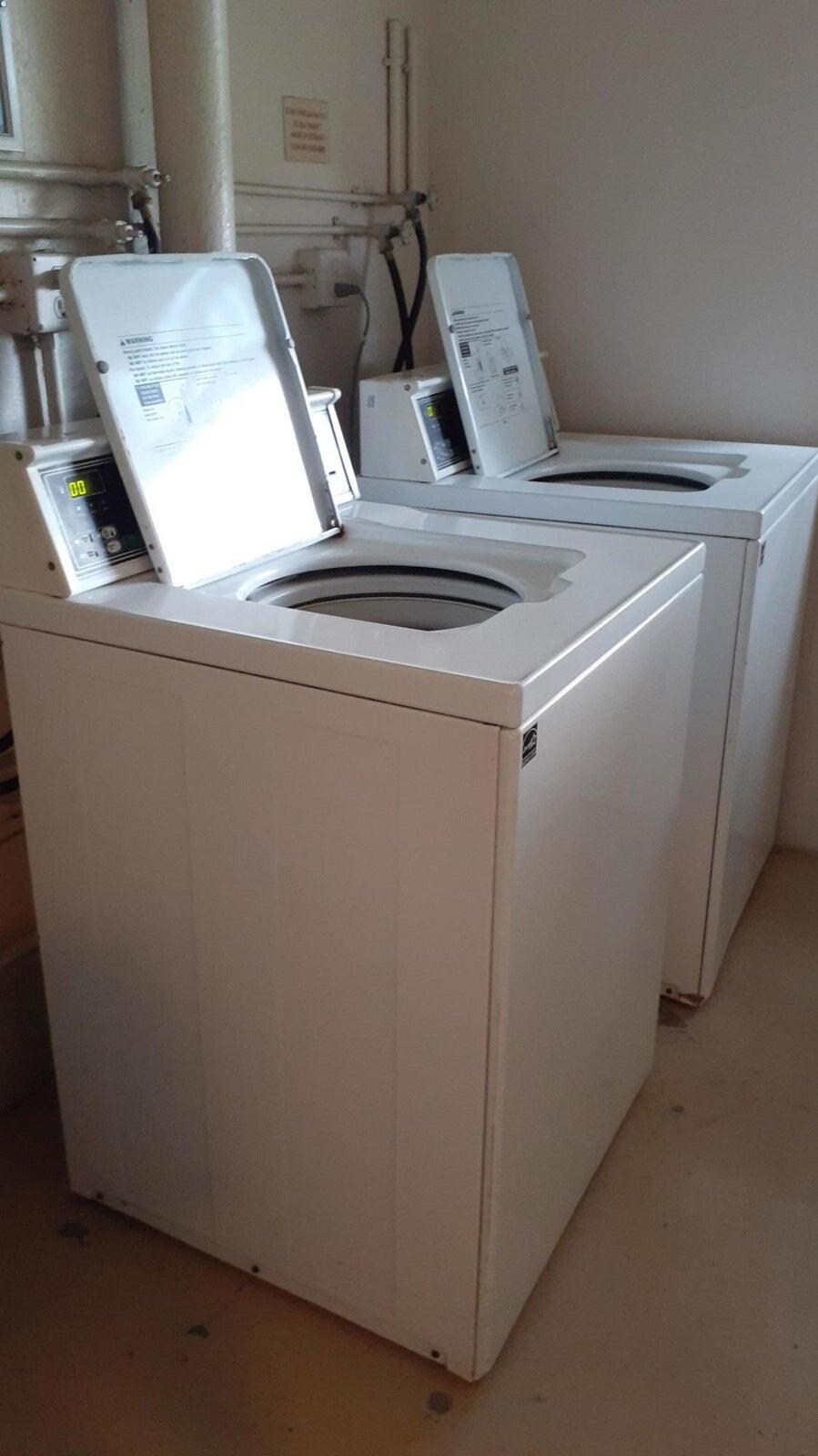 2601 South Course Drive, Unit 203 Pompano Beach, FL 33069 - Photo 32 of 33 a close up view of washer and dryer