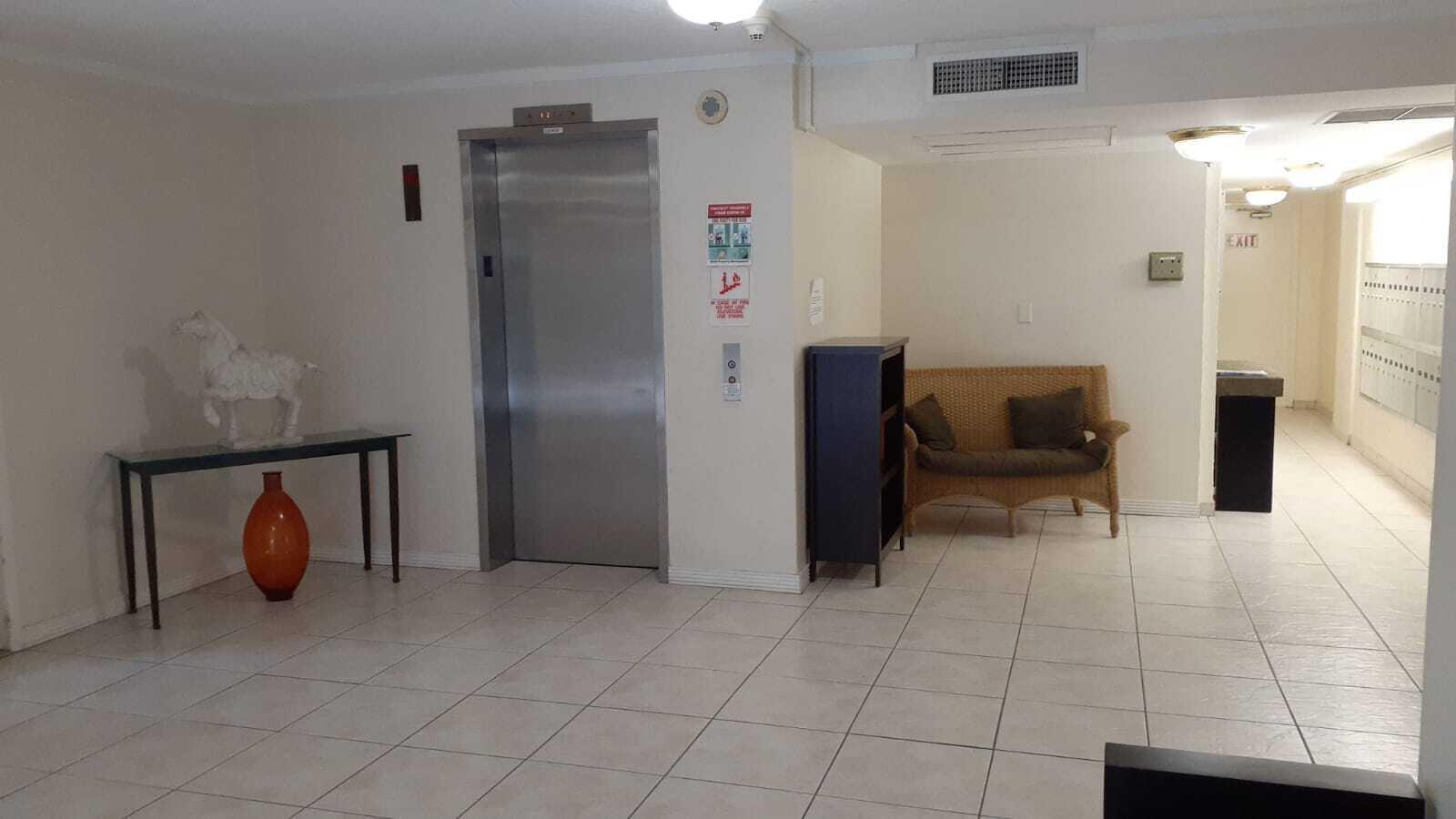 2601 South Course Drive, Unit 203 Pompano Beach, FL 33069 - Photo 5 of 33 a view of kitchen with furniture and a refrigerator