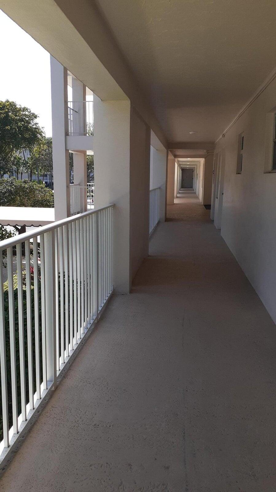 2601 South Course Drive, Unit 203 Pompano Beach, FL 33069 - Photo 6 of 33 a view of a balcony with furniture