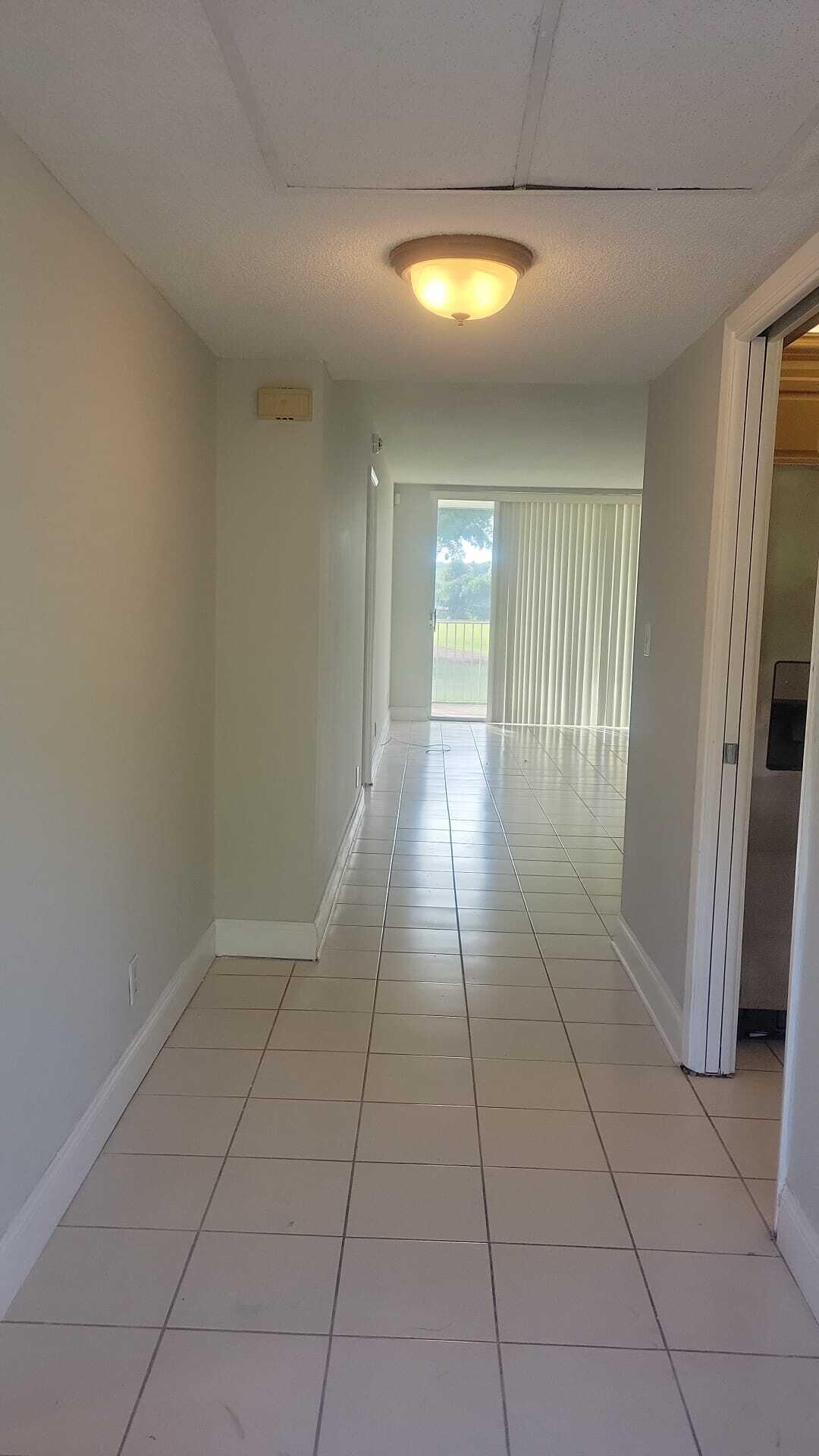 2601 South Course Drive, Unit 203 Pompano Beach, FL 33069 - Photo 8 of 33 a view of an empty room and window