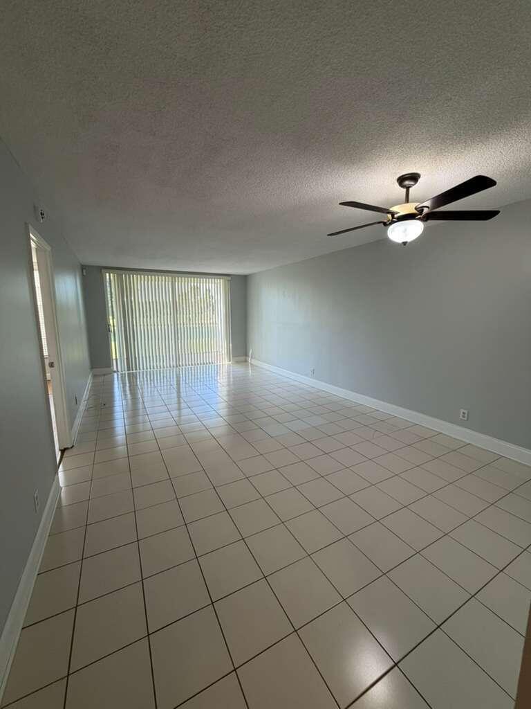 2601 South Course Drive, Unit 203 Pompano Beach, FL 33069 - Photo 9 of 33 a view of an empty room with a window