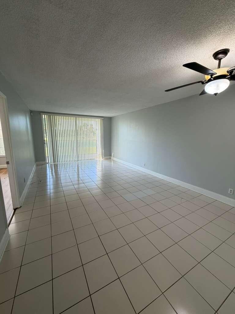2601 South Course Drive, Unit 203 Pompano Beach, FL 33069 - Photo 10 of 33 en empty room with windows