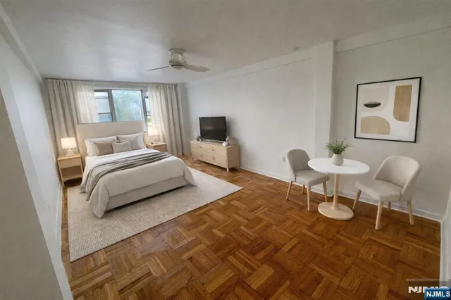 a bedroom with a bed and a table