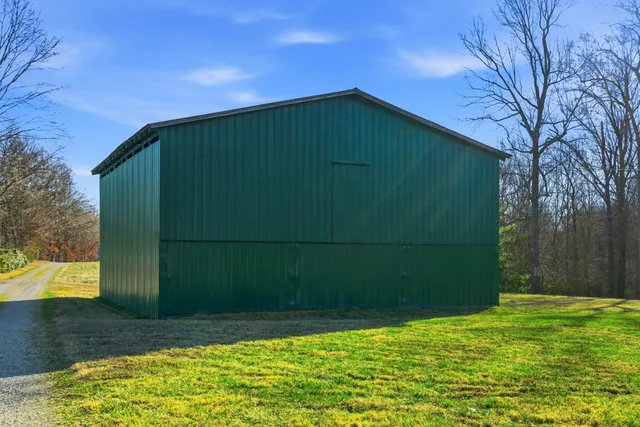 a kitchen with granite countertop wood cabinets stainless steel appliances and a counter top space