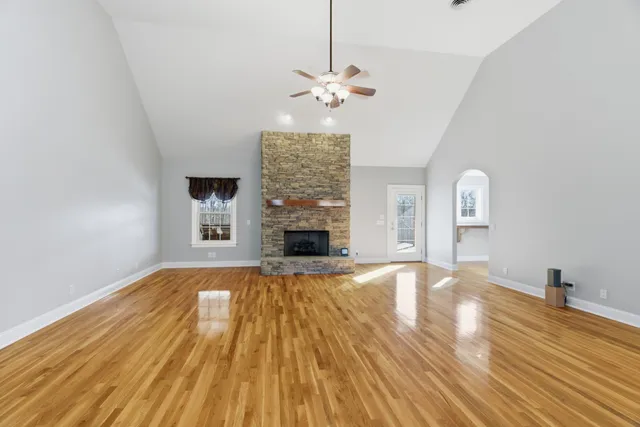 a kitchen with granite countertop a sink and cabinets