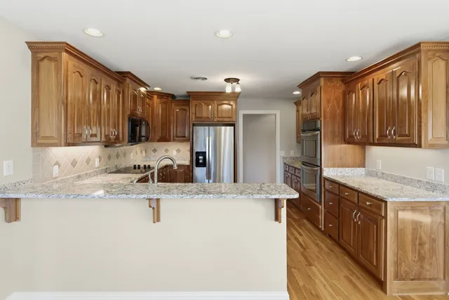 a bathroom with a bath tub with a shower