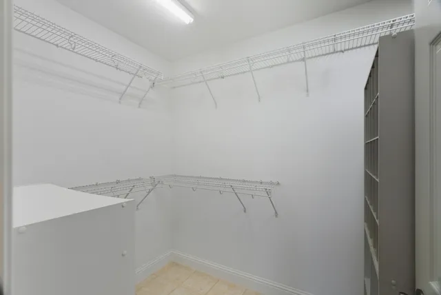 a view of a yard with wooden fence