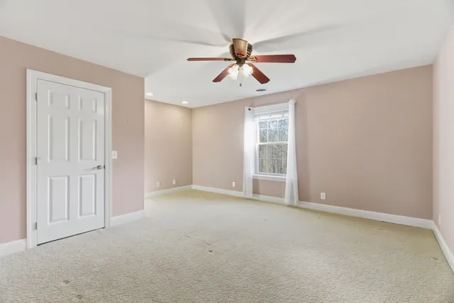 a view of a yard with a tree