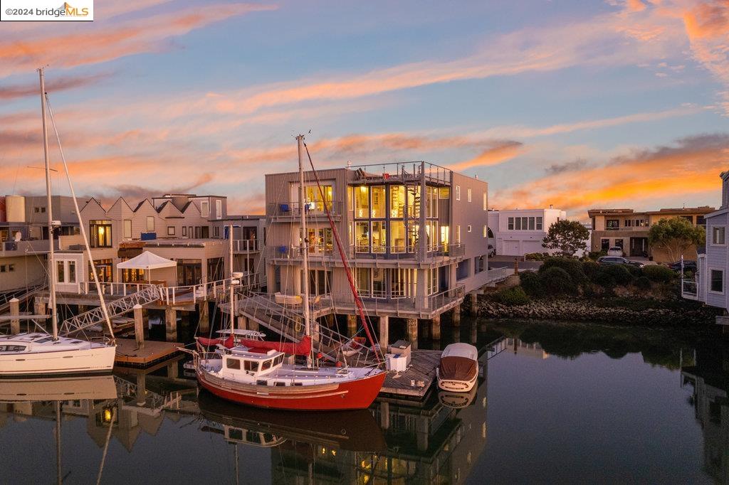 a view of a lake with couches and city view