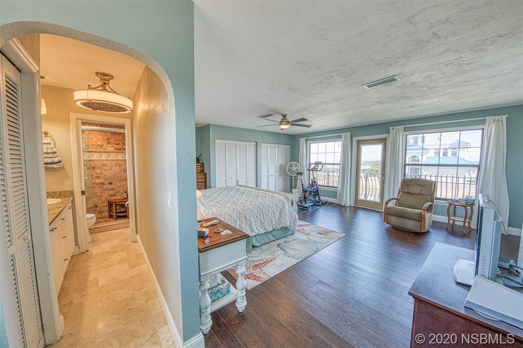 4718 South Atlantic Avenue Ponce Inlet, FL 32127 - Photo 16 of 22 a living room with furniture and a wooden floor