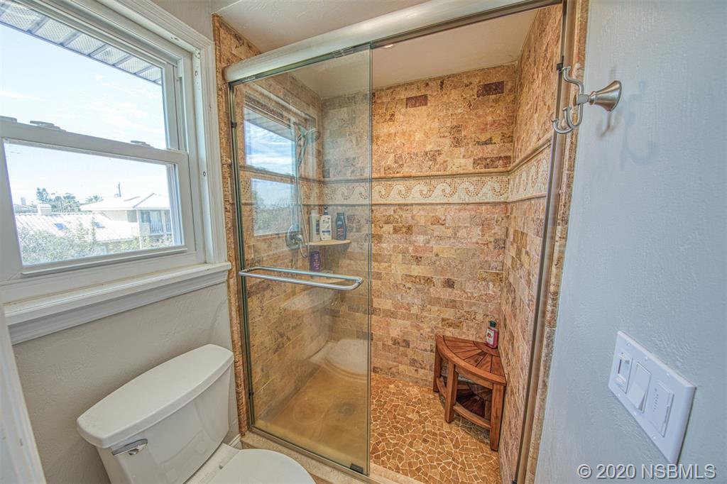 4718 South Atlantic Avenue Ponce Inlet, FL 32127 - Photo 18 of 22 a bathroom with a toilet and a shower