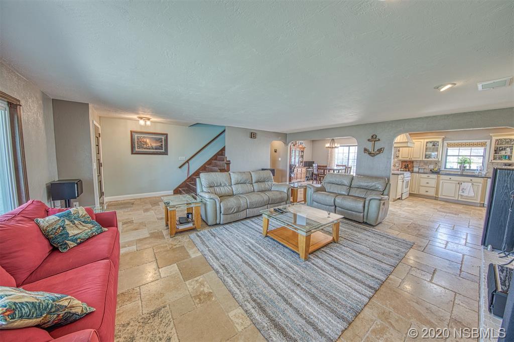 4718 South Atlantic Avenue Ponce Inlet, FL 32127 - Photo 6 of 22 a living room with furniture and a table