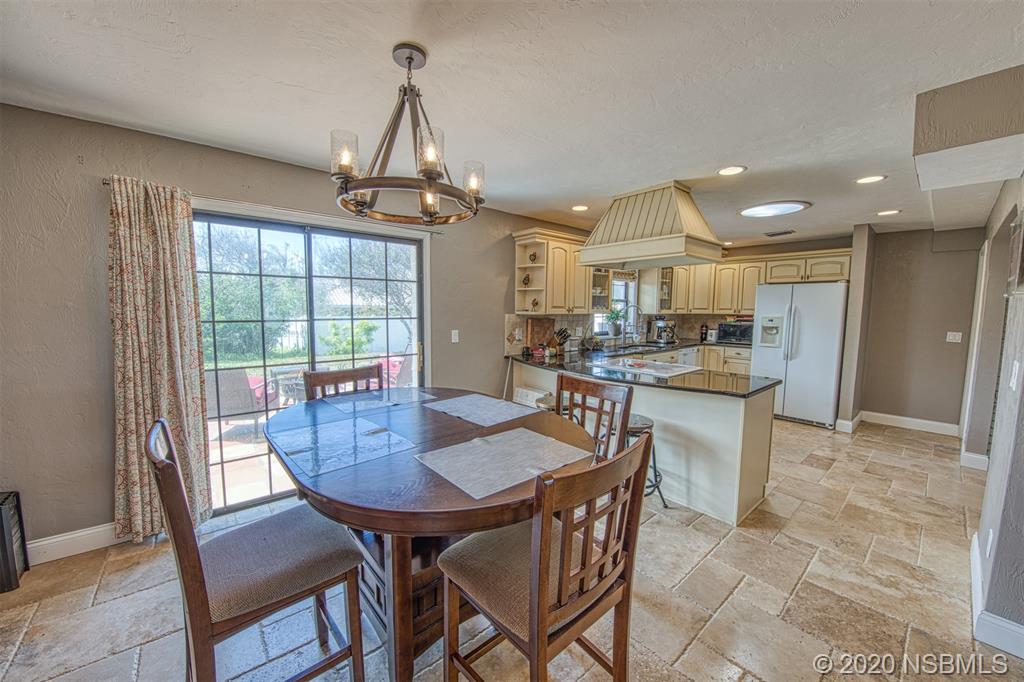 4718 South Atlantic Avenue Ponce Inlet, FL 32127 - Photo 7 of 22 a view of a dining room with furniture