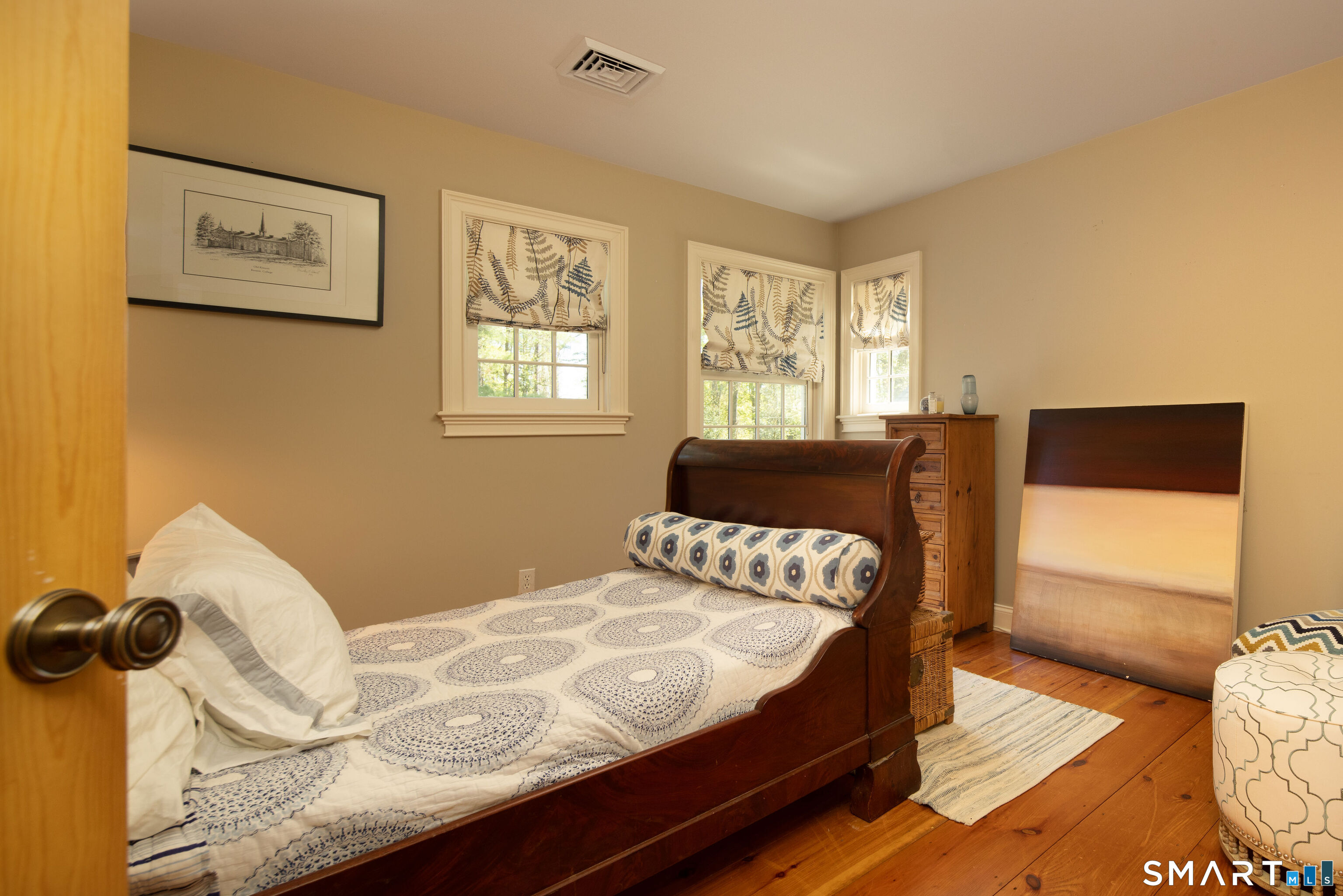 7 Cooper Hill Road Salisbury, CT 06068 - Photo 29 of 36 a bedroom with a bed and wooden floor