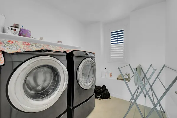a utility room with dryer and washer