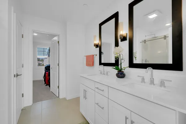 a bathroom with a shower a toilet and a sink