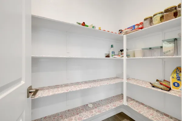 a kitchen with granite countertop a sink and a stove