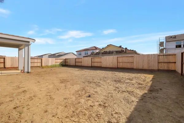 a view of a house with a snow in the background