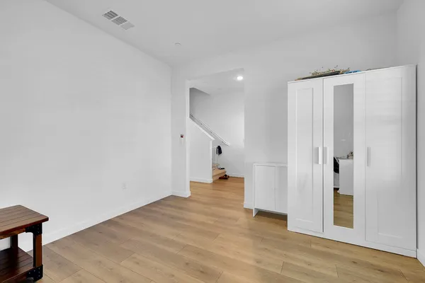 a view of entryway with wooden floor