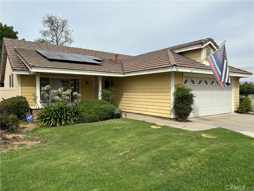 551 Carnes Circle Redlands, CA 92374 - Photo 1 of 1 a front view of a house with a yard