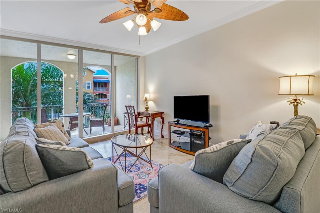 401 Bayfront Place, Unit 3408 Naples, FL 34102 - Photo 2 of 26 a living room with furniture and a flat screen tv