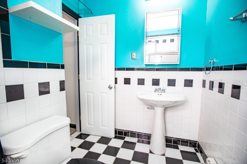 1130 Valley Road, Unit 2B Wayne, NJ 07470 - Photo 4 of 47 a bathroom with a sink a toilet and shower
