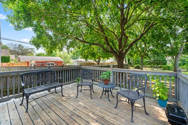 a view of a deck with wooden floor and fence
