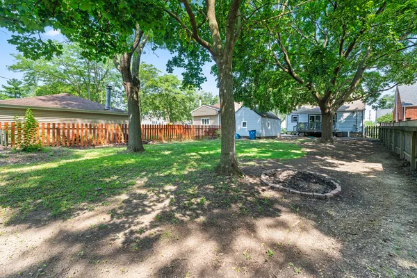 a backyard of a house with lots of green space