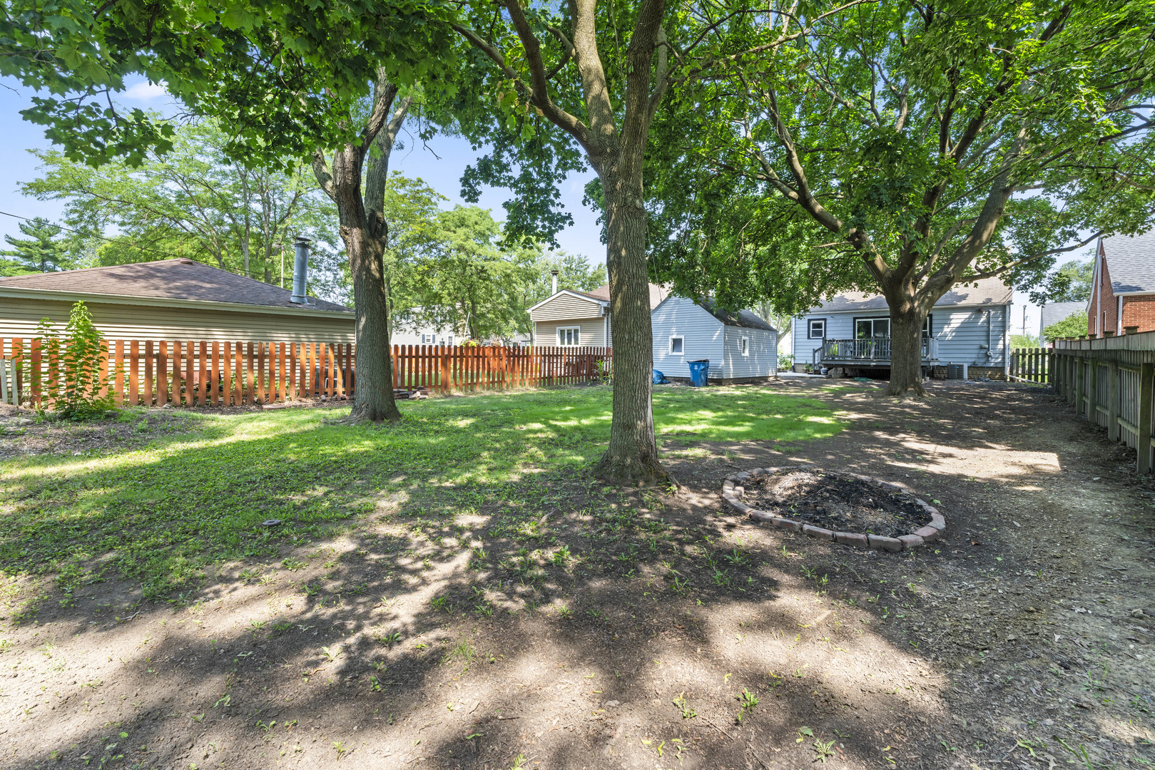 660 1st Street Crete, IL 60417 - Photo 22 of 23 a backyard of a house with lots of green space