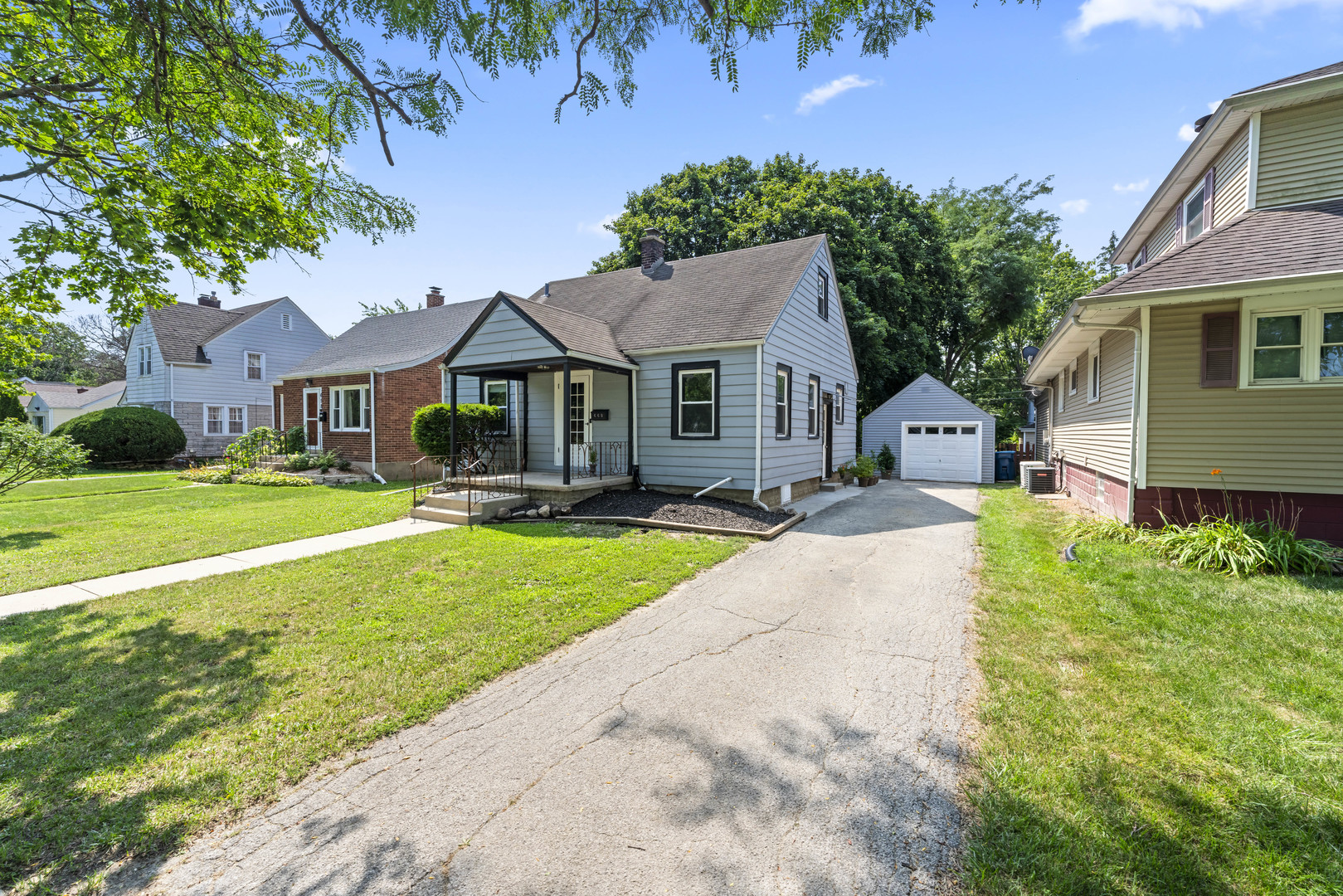 660 1st Street Crete, IL 60417 - Photo 3 of 23 a front view of a house with a yard