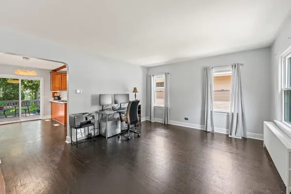 a work room with furniture and wooden floor
