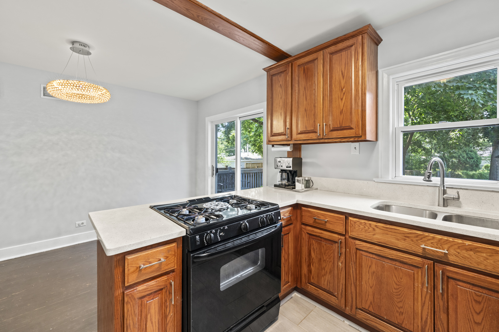 660 1st Street Crete, IL 60417 - Photo 7 of 23 a kitchen with stainless steel appliances granite countertop a sink stove and cabinets