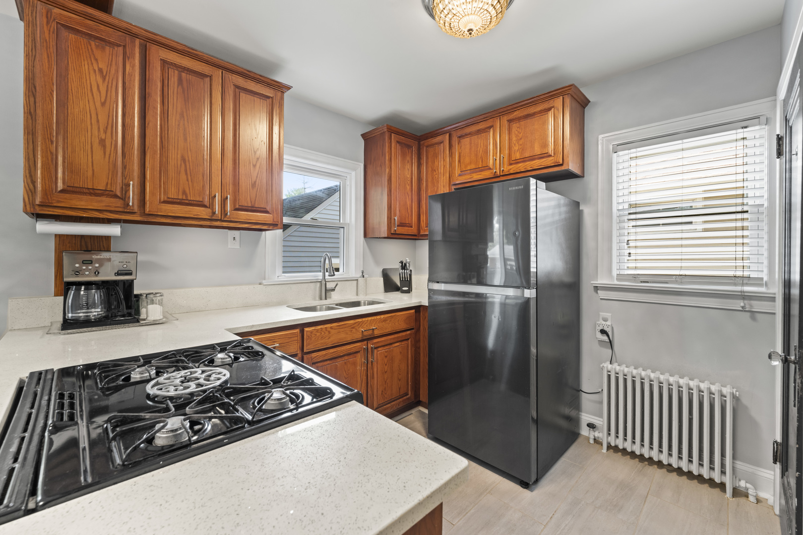 660 1st Street Crete, IL 60417 - Photo 8 of 23 a kitchen with stainless steel appliances granite countertop a stove a refrigerator and a sink
