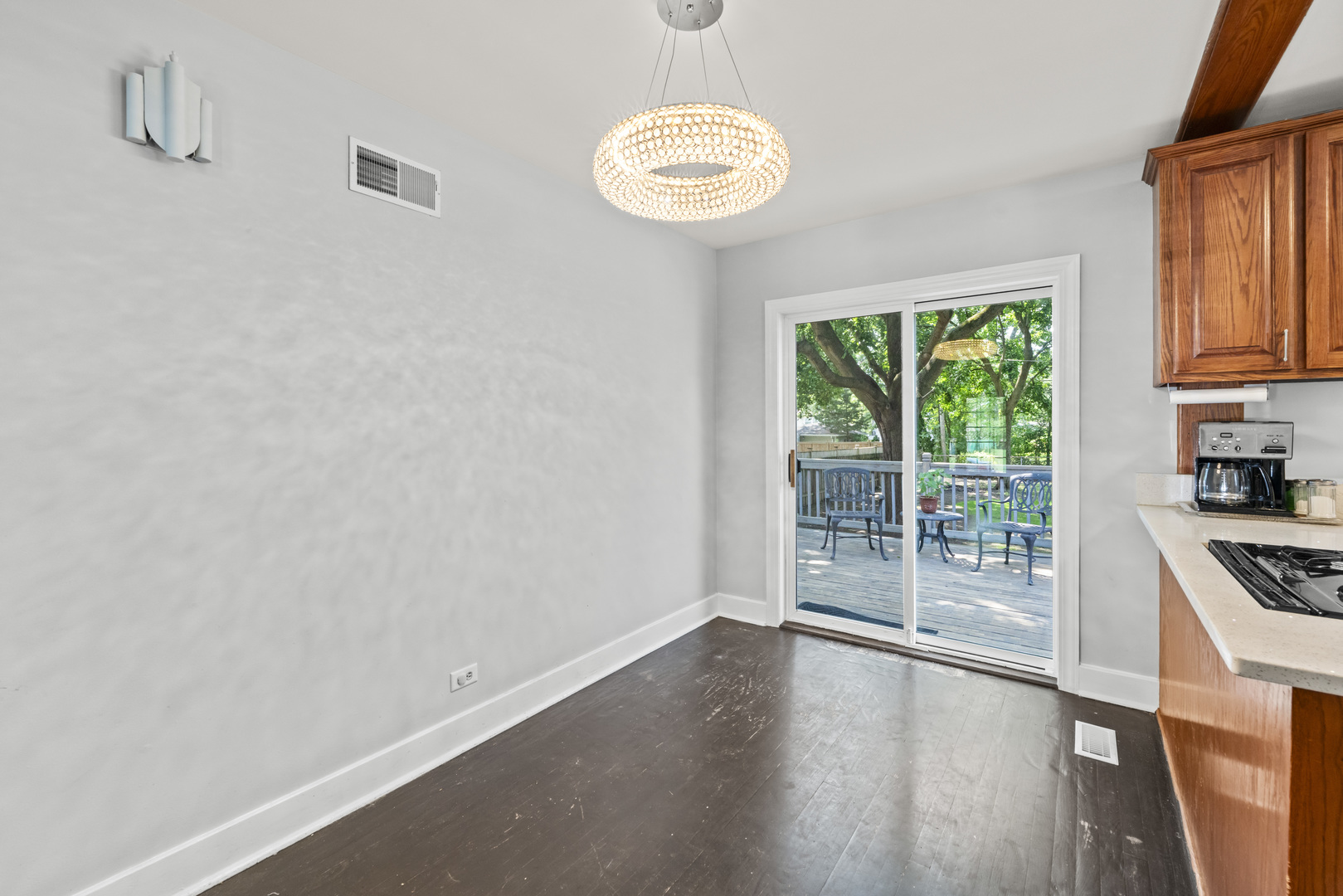 660 1st Street Crete, IL 60417 - Photo 9 of 23 a view of a kitchen with wooden floor and a window