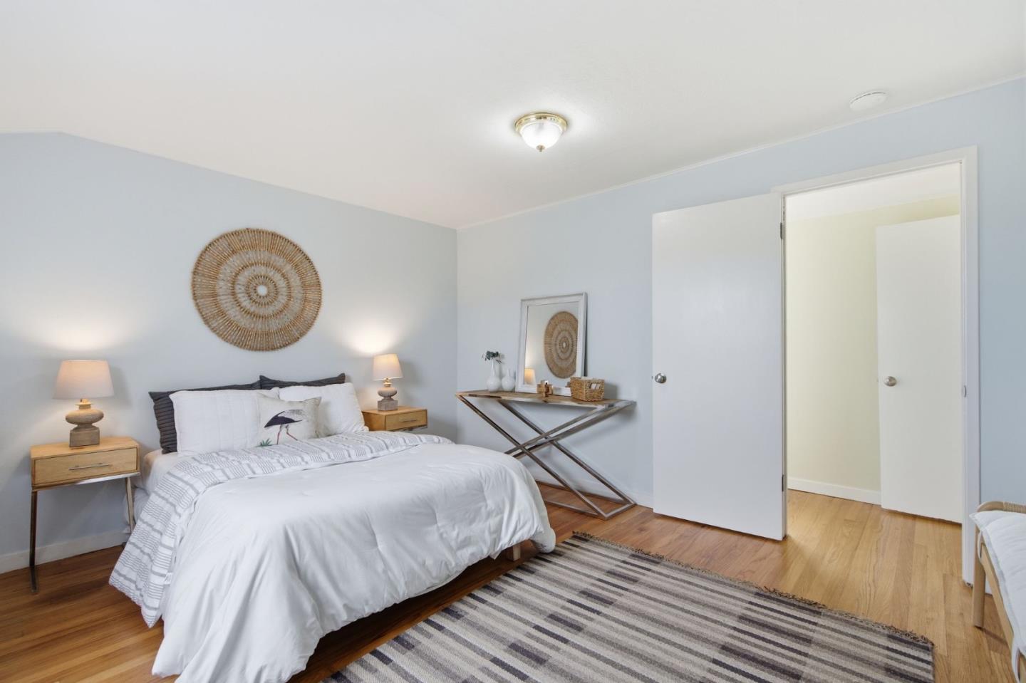 1263 Reservoir Road Pescadero, CA 94060 - Photo 32 of 66 a bedroom with a bed and a lamp on dresser