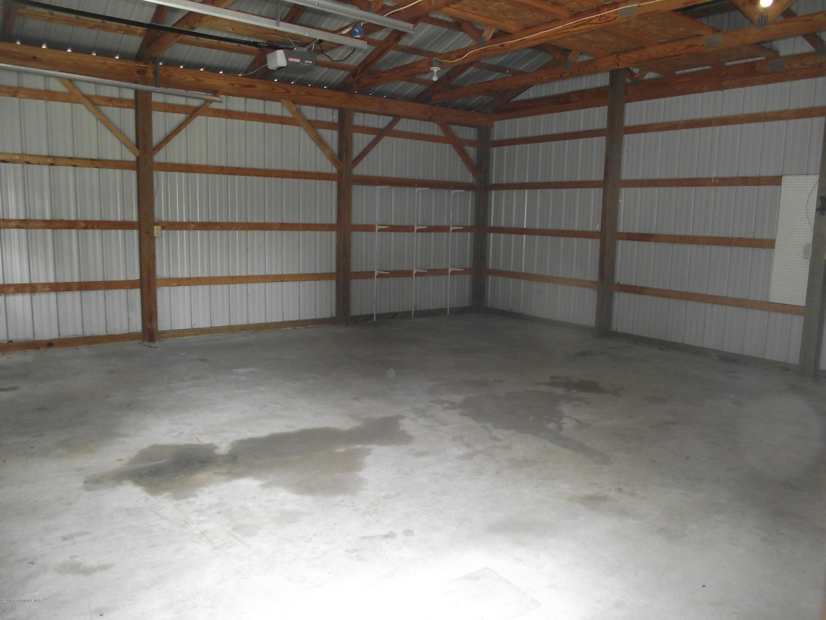 684 Gilbert Road Gilbert, PA 18331 - Photo 16 of 31 a view of a room with racks on the wall
